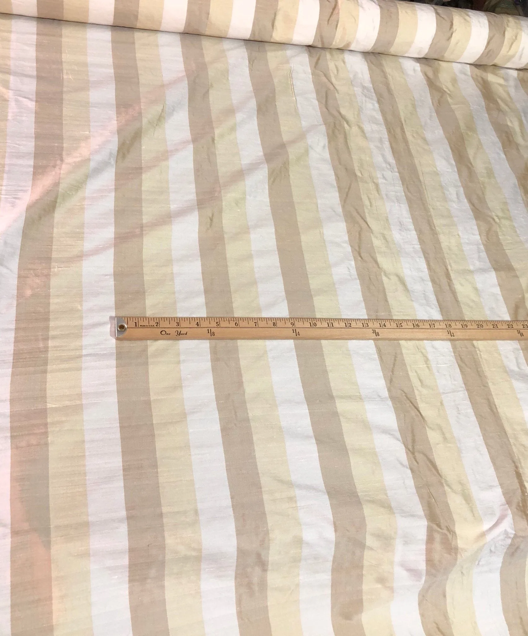 100% silk shantung stripe, 54&quot; wide. Beautiful ivory brownish yellow gold. Fabric sold by the yard.